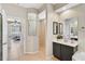 Well-lit bathroom featuring a walk-in shower, vanity with storage, and modern fixtures at 10030 Reagan Dairy Trl, Bradenton, FL 34212