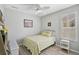 Charming bedroom with a cottage style bed, complemented by light-colored walls and floors at 10030 Reagan Dairy Trl, Bradenton, FL 34212