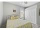 Charming bedroom with a cottage style bed, complemented by light-colored walls and floors at 10030 Reagan Dairy Trl, Bradenton, FL 34212