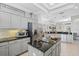 Modern kitchen featuring granite countertops, stainless steel appliances, and ample cabinet space at 10030 Reagan Dairy Trl, Bradenton, FL 34212