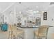Stylish kitchen featuring granite countertops, stainless steel appliances, pendant lighting, and a breakfast bar with seating at 10030 Reagan Dairy Trl, Bradenton, FL 34212