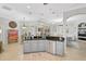 Bright kitchen with stainless steel appliances, pendant lighting, and an adjoining dining area at 10030 Reagan Dairy Trl, Bradenton, FL 34212