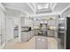 Bright, spacious kitchen with modern appliances, granite countertops, and ample storage space, adjacent to a breakfast nook at 10030 Reagan Dairy Trl, Bradenton, FL 34212
