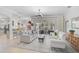 Bright living room with a comfortable seating area and large windows offering natural light and views of the outdoor space at 10030 Reagan Dairy Trl, Bradenton, FL 34212