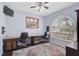 Well-lit office space features a large window, custom built-ins, and comfortable seating at 10030 Reagan Dairy Trl, Bradenton, FL 34212