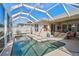 Sparkling pool with a screened enclosure offers a private and refreshing outdoor experience at 10030 Reagan Dairy Trl, Bradenton, FL 34212