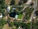 Aerial view of the property with the pond and swimming pool highlighted by a border at 1228 Wagon Wheel Dr, Sarasota, FL 34240