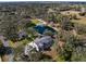 Beautiful home with a private pond and a swimming pool and patio with lounge seating at 1228 Wagon Wheel Dr, Sarasota, FL 34240