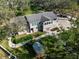 Aerial view of the property highlighting the lush greenery, spacious layout, and charming shed at 1228 Wagon Wheel Dr, Sarasota, FL 34240