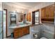 Neutral bathroom with stand-up shower, toilet, and a double sink vanity at 1228 Wagon Wheel Dr, Sarasota, FL 34240