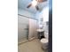 Accessible bathroom featuring a walk-in shower, grab bars, and convenient fixtures at 1228 Wagon Wheel Dr, Sarasota, FL 34240