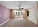 Bedroom showcasing natural light, a ceiling fan and a doorway leading to another room at 1228 Wagon Wheel Dr, Sarasota, FL 34240