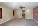 Bedroom featuring neutral walls, carpet, and a doorway leading to the en suite bath at 1228 Wagon Wheel Dr, Sarasota, FL 34240
