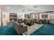 Bonus room furnished with multiple sofas, coffee table, and a scenic view from the windows at 1228 Wagon Wheel Dr, Sarasota, FL 34240