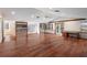 Bonus room boasting wood floors, multiple windows, a ceiling fan, and a built-in desk at 1228 Wagon Wheel Dr, Sarasota, FL 34240