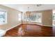 Dining room with hardwood floors and a large window at 1228 Wagon Wheel Dr, Sarasota, FL 34240