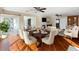 Open concept dining and living room with modern decor and lots of natural light at 1228 Wagon Wheel Dr, Sarasota, FL 34240
