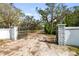 Elegant gated entrance with decorative pillars, leading to a private estate at 1228 Wagon Wheel Dr, Sarasota, FL 34240