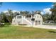 Beautiful home with a spacious lawn, charming outbuilding, and a basketball court at 1228 Wagon Wheel Dr, Sarasota, FL 34240