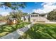 Expansive home with lush green lawn and charming shed, ideal for outdoor enjoyment and relaxation at 1228 Wagon Wheel Dr, Sarasota, FL 34240