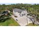 Beautifully landscaped two-story home with three-car garage and extended driveway at 1228 Wagon Wheel Dr, Sarasota, FL 34240