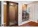 Elevator adjacent to laundry room with newer washer and dryer and storage at 1228 Wagon Wheel Dr, Sarasota, FL 34240