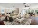 Bright and airy living room boasts hardwood floors and an open floor plan at 1228 Wagon Wheel Dr, Sarasota, FL 34240