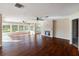 Expansive living room with hardwood floors, fireplace, and lots of natural light at 1228 Wagon Wheel Dr, Sarasota, FL 34240