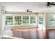Sun-filled living room boasting hardwood floors and large windows, providing ample natural light at 1228 Wagon Wheel Dr, Sarasota, FL 34240