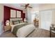 Bedroom with a dark accent wall, carpet, and built in desk area at 1228 Wagon Wheel Dr, Sarasota, FL 34240