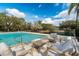 Outdoor pool patio with comfortable seating at 1228 Wagon Wheel Dr, Sarasota, FL 34240