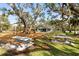 The community playground features swings, slides, and picnic tables for outdoor enjoyment at 1228 Wagon Wheel Dr, Sarasota, FL 34240