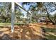 Playground with swings, slides, and wood-chip ground cover providing a safe play area at 1228 Wagon Wheel Dr, Sarasota, FL 34240