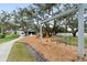 Community playground featuring swings and slides at 1228 Wagon Wheel Dr, Sarasota, FL 34240