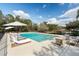 Inviting swimming pool with a stylish outdoor seating and landscape at 1228 Wagon Wheel Dr, Sarasota, FL 34240