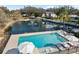 Outdoor pool with lounge seating and a view of the pond at 1228 Wagon Wheel Dr, Sarasota, FL 34240