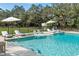 Stunning pool with shallow water sun loungers and patio with lounge seating at 1228 Wagon Wheel Dr, Sarasota, FL 34240