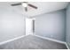 Spacious bedroom with neutral paint, carpeting, ceiling fan and adjoining bath at 13227 Prestwick Creek Dr, Riverview, FL 33579