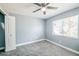 Bedroom with a ceiling fan, closet, and a window bringing in natural light at 13227 Prestwick Creek Dr, Riverview, FL 33579