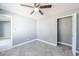 Comfortable bedroom with soft carpeting and closet at 13227 Prestwick Creek Dr, Riverview, FL 33579