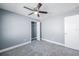 Bedroom featuring gray walls, ceiling fan, and closet with white door at 13227 Prestwick Creek Dr, Riverview, FL 33579