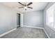 Cozy bedroom with soft carpeting, ample natural light, and a closet for storage at 13227 Prestwick Creek Dr, Riverview, FL 33579
