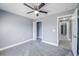 Bedroom featuring a ceiling fan, closet, and convenient access to hallway at 13227 Prestwick Creek Dr, Riverview, FL 33579