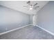 The gray bedroom has a fan, and carpeted floor at 13227 Prestwick Creek Dr, Riverview, FL 33579