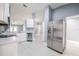 Bright kitchen with stainless steel appliances and easy access to dining and living area at 13227 Prestwick Creek Dr, Riverview, FL 33579
