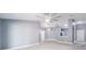 Spacious living room with fan, tile floors and view of the kitchen at 13227 Prestwick Creek Dr, Riverview, FL 33579