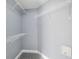Spacious walk-in closet with ample shelving for organized storage solutions at 13227 Prestwick Creek Dr, Riverview, FL 33579