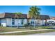 Charming single-story home with stone accents, landscaped lawn, attached garage and cozy curb appeal at 13575 Martha Ave, Port Charlotte, FL 33981