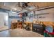 Functional garage featuring ample workspace, pegboard storage, and access to laundry facilities at 13575 Martha Ave, Port Charlotte, FL 33981