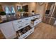 Kitchen island provides ample storage with drawers and shelves and has granite countertops at 13575 Martha Ave, Port Charlotte, FL 33981